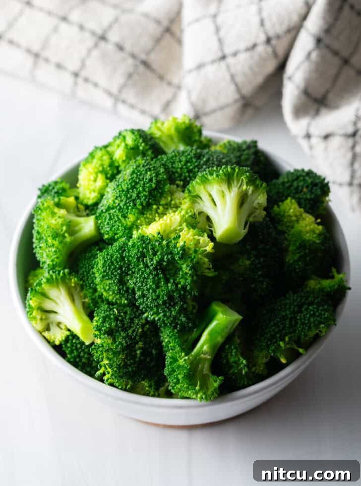 Achieve Perfectly Tender Broccoli Every Time 7 Perfectly boiled broccoli florets served in a bowl