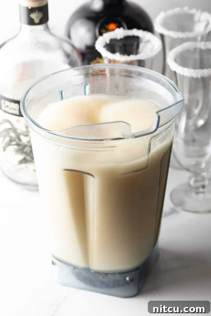 The Ultimate Frozen Margarita 10 Blender filled with frozen margaritas.