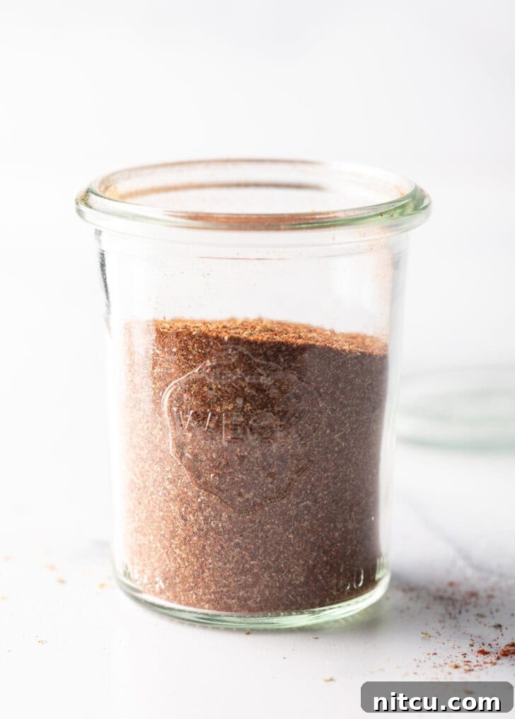 Zesty Chicken Taco Blend 8 A tall glass jar showcasing the perfectly blended, uniform chicken taco seasoning, ready for culinary use.