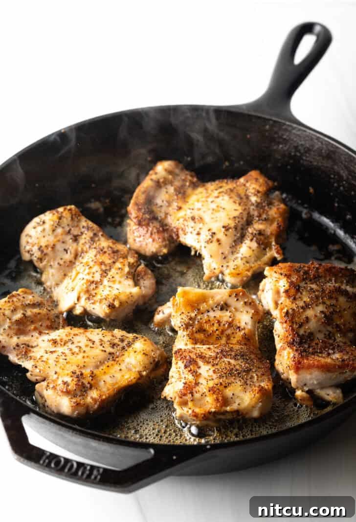 Proposal-Worthy Chicken Pasta 6 5 cooked chicken thighs with a beautiful sear in a cast iron skillet.