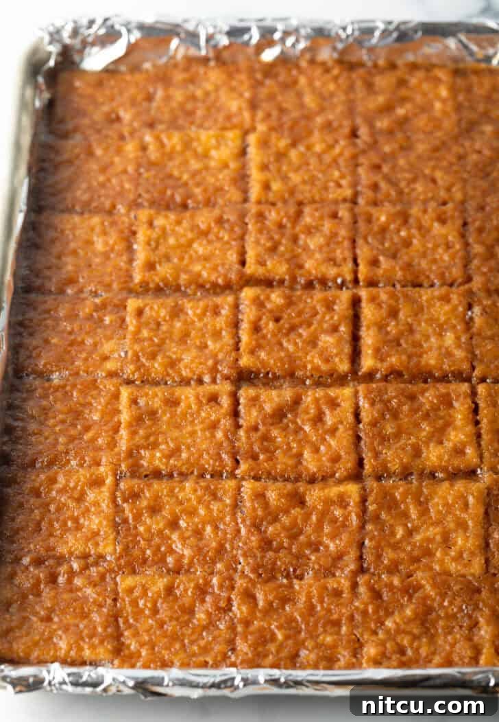 Baking sheet covered with toffee-soaked saltine crackers.