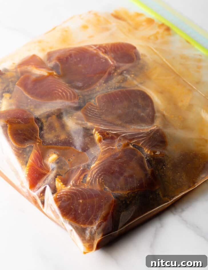 Flash-Seared Ahi Tuna 9 Several tuna steaks marinating in a ziploc bag, ensuring full flavor absorption.