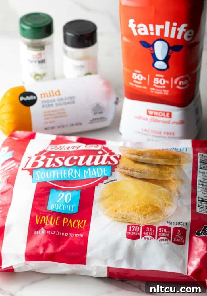 Ingredients for biscuits and gravy casserole laid out on a counter.
