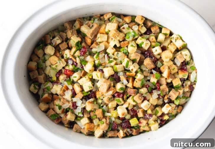 Effortless Crock Pot Stuffing 9 Crock pot dressing fully assembled and ready to be cooked in the slow cooker.