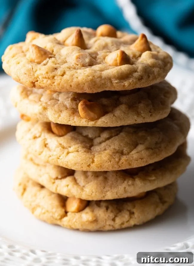 Close-up stack of freshly baked Oatmeal Butterscotch Cookies, showcasing their golden-brown edges and soft centers.