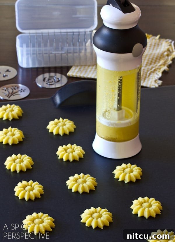 Zesty Lemon Spritz Delights 3 Lemon Pressed Cookies Recipe Cookie Press Gun - shown as yellow flowers