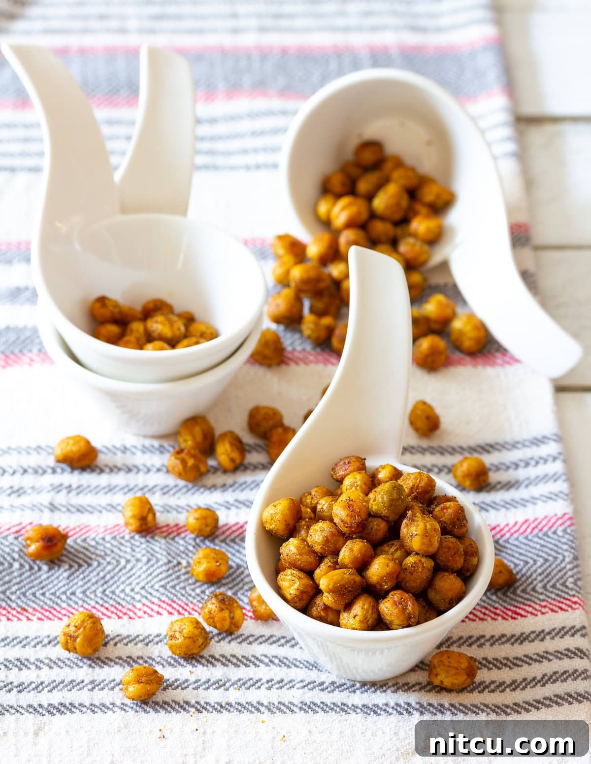 Garbanzo Beans A bowl of flavorful roasted garbanzo beans, perfectly spiced for a healthy treat.