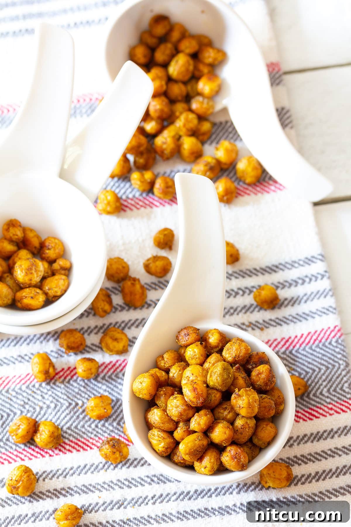 Indian-Chickpeas A bowl of Indian-spiced baked chickpeas, a healthy and delicious snack.
