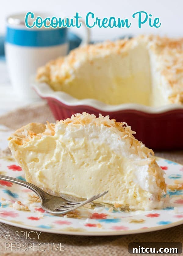 Delicious Coconut Cream Pie Slice Coconut Cream Pie Recipe - slice of pie placed on plate with creamy filling