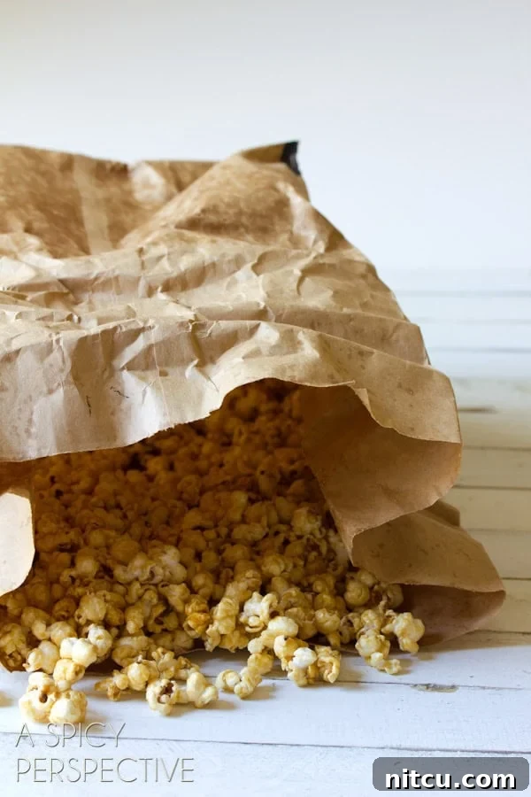 Mastering Garretts Famous Popcorn 3 Paper bag filled with caramel popcorn.