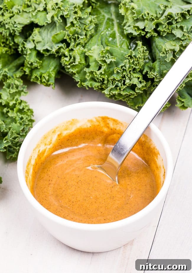 Effortless Crispy Kale Chips 7 Blended almond butter and spices in a bowl.