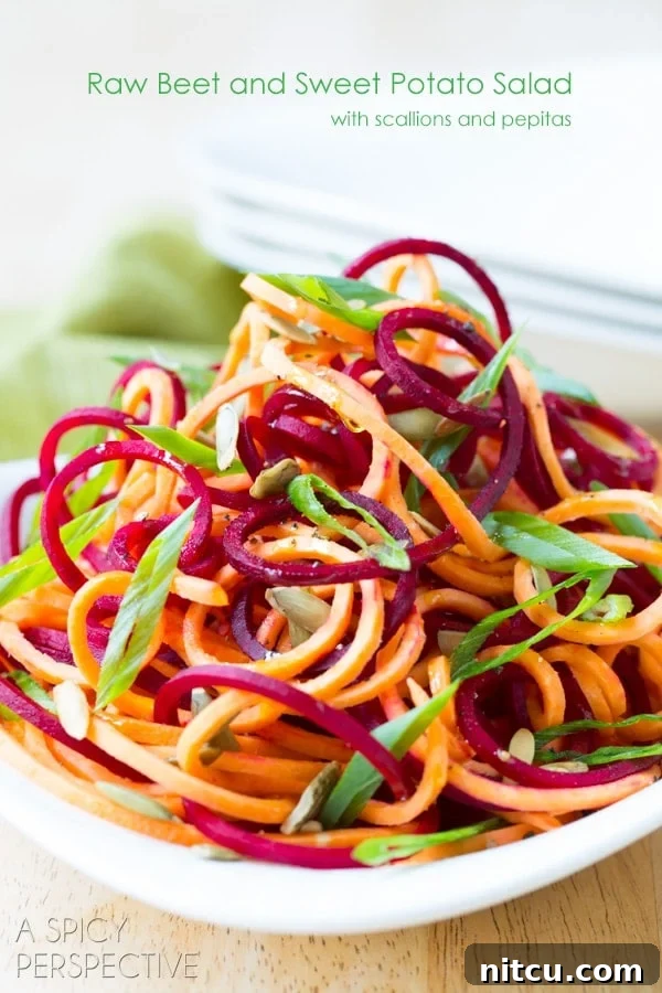 Close-up of Raw Beet and Sweet Potato Salad showcasing vibrant colors and textures