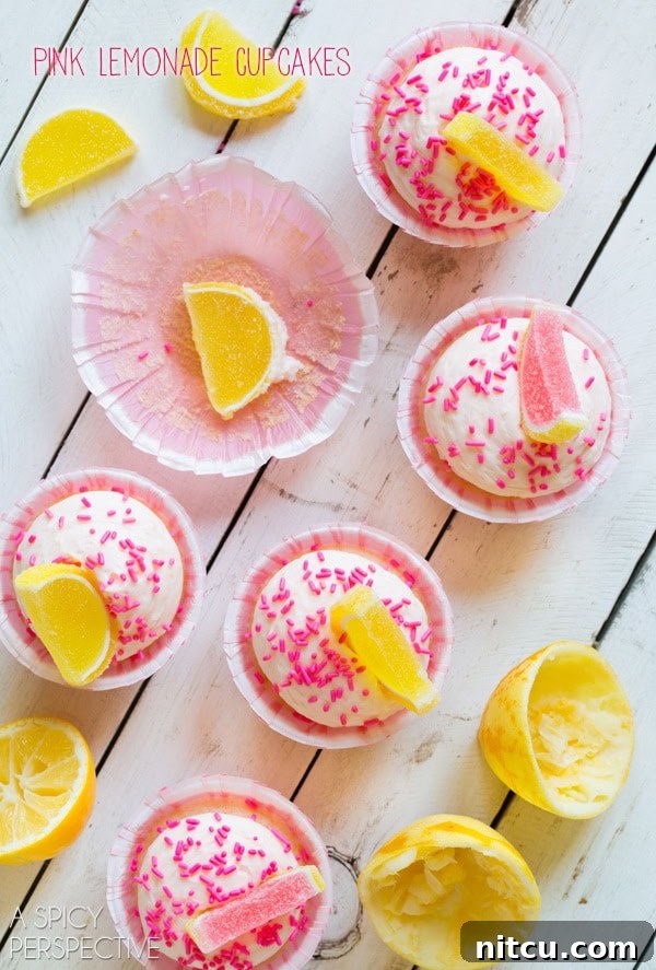 Pink Lemonade Cupcakes! Sweet and tangy, perfect for summer. #lemon #lemonade #cupcakes #pink #kitchenconvo