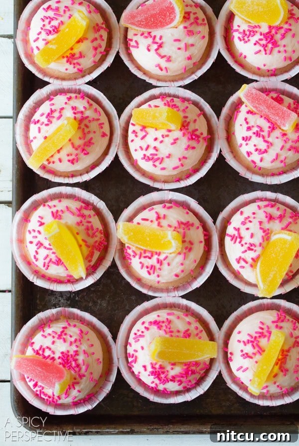 Easy Pink Lemonade Cupcakes, a simple recipe for a delightful summer treat. #lemon #lemonade #cupcakes #pink #kitchenconvo