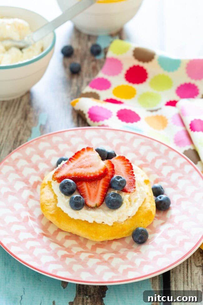 Sweet Start Fruit Pizza 6 A single simple breakfast fruit pizza served on a plate, showcasing its vibrant toppings.