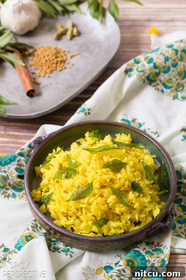 A perfectly plated bowl of Indian rice, showcasing its fluffy texture and golden hue, ready to be enjoyed.