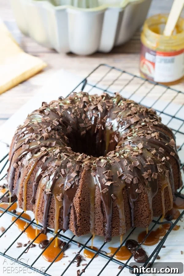 Irish Cream Dream Bundt 8 A decorative Baileys Irish Cream Bundt Cake adorned with delicate chocolate shavings, highlighting its rich texture and enticing aroma.