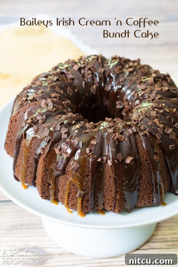 Irish Cream Dream Bundt 9 A close-up view of the Baileys Irish Cream Bundt Cake on a platter, highlighting its intricate design and the glossy finish of its toppings.