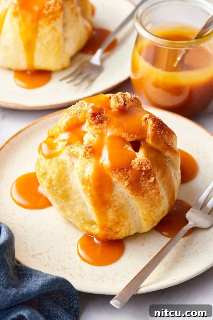 Flaky Apple Pastry Pockets 2 Simple baked apple recipe with puff pastry on a plate, caramel sauce over the top