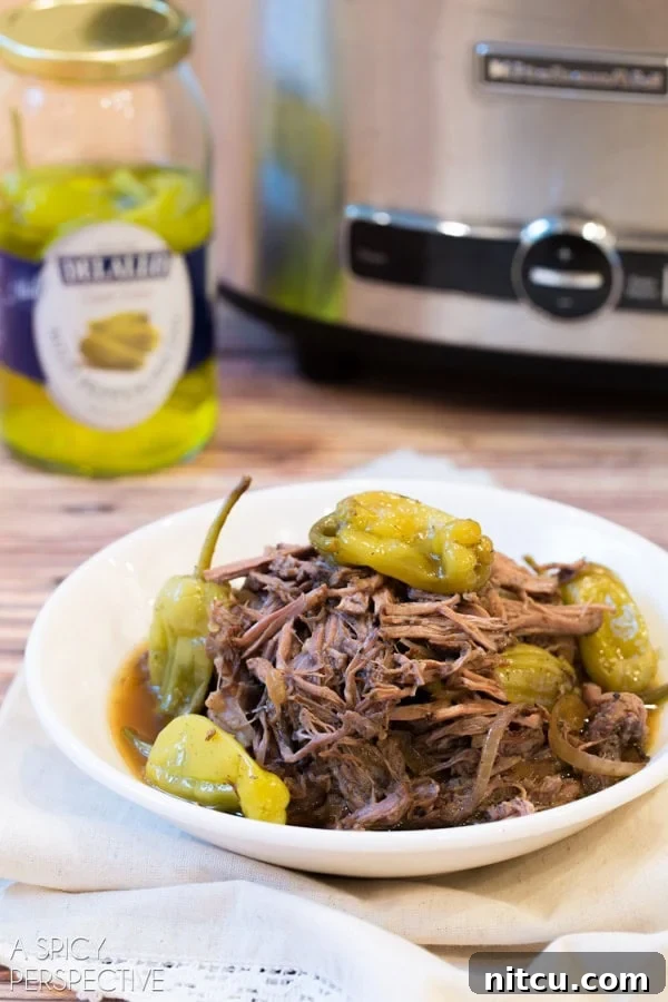 Perfect Slow Cooker Italian Beef 6 Easy Crockpot Italian Beef Recipe served on a plate with various toppings