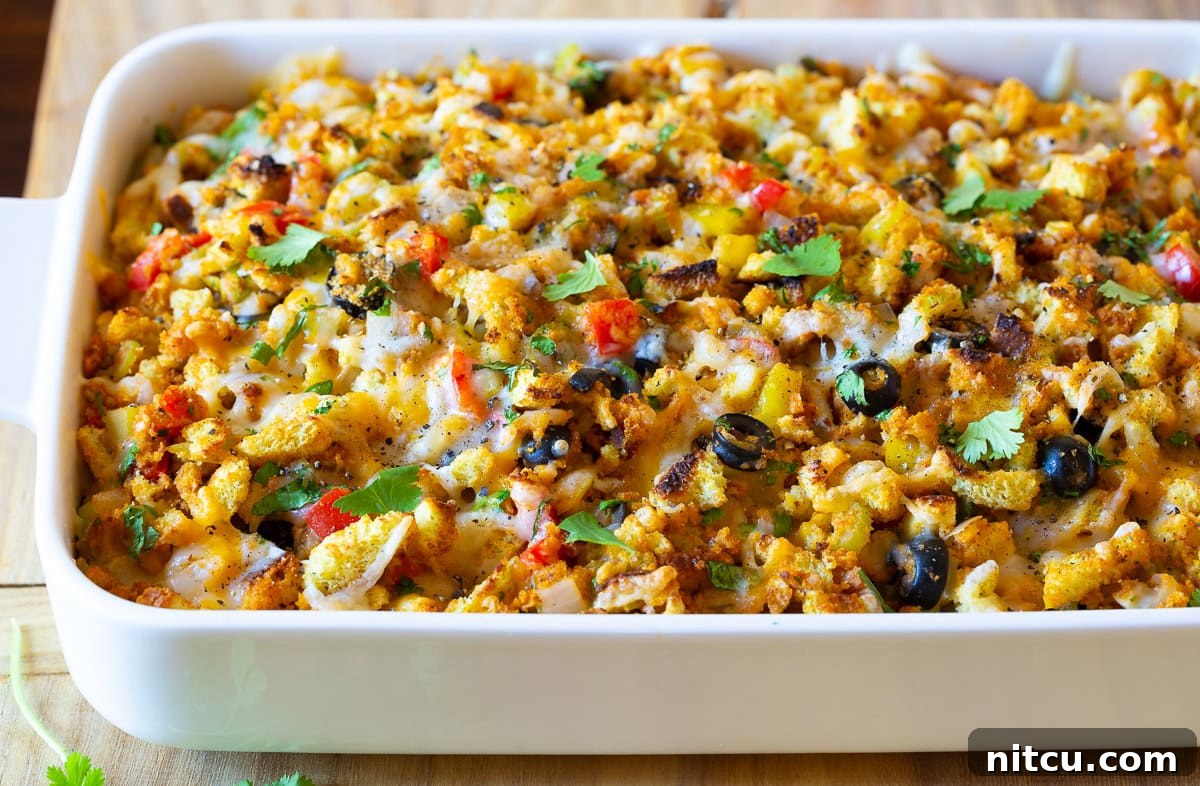 Baked Stuffing Close-Up Mexican Thanksgiving stuffing after baking, showcasing a golden brown top and melted cheese