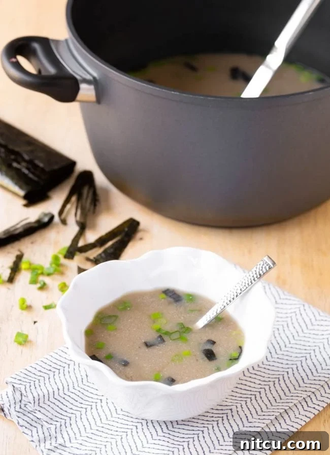 miso-broth A single serving of Japanese Miso Soup, showcasing its comforting appeal in a bowl.
