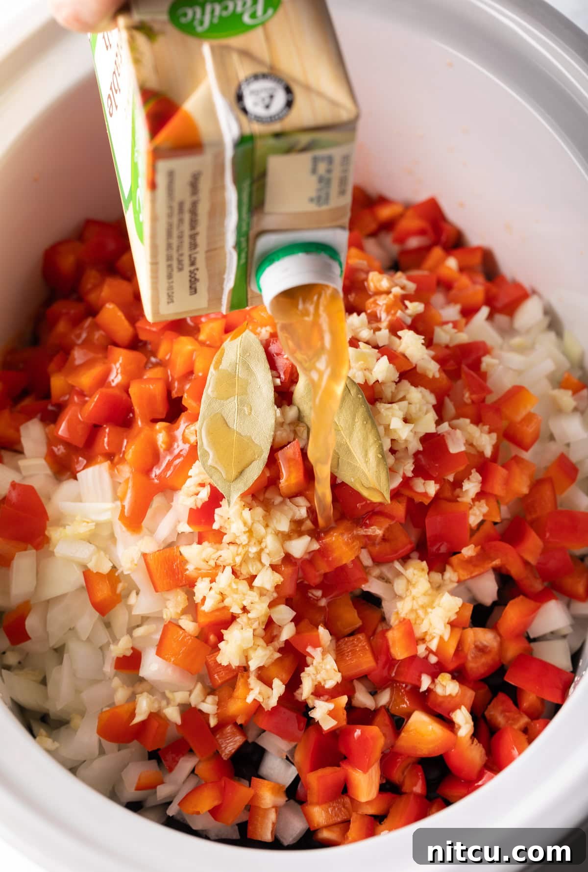 Slow Cooker Black Bean Bliss 5 Ingredients for black bean soup all thrown into a slow cooker, ready for cooking.