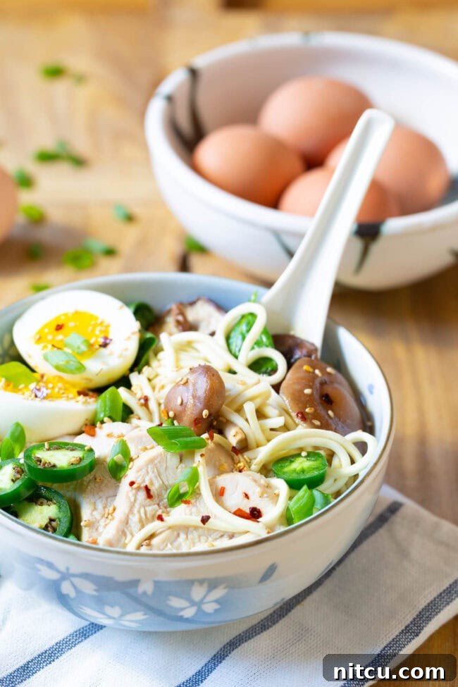 A close-up shot of a slow cooker filled with the simmering ingredients for Fancy Ramen, showing the rich broth and cooking process.