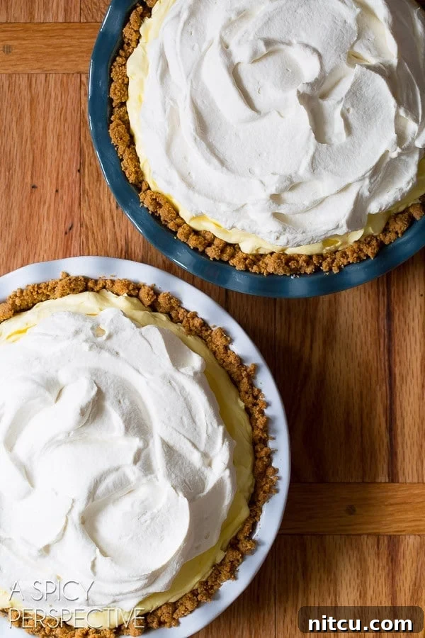 Luscious Lemon Cream Pie 5 Lemon cream pies before getting a sprinkle of graham crackers on top of the cream.