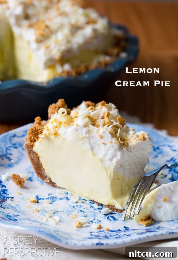 Luscious Lemon Cream Pie 9 Slice of lemon cream pie on a plate with the words "lemon cream pie" in the corner.