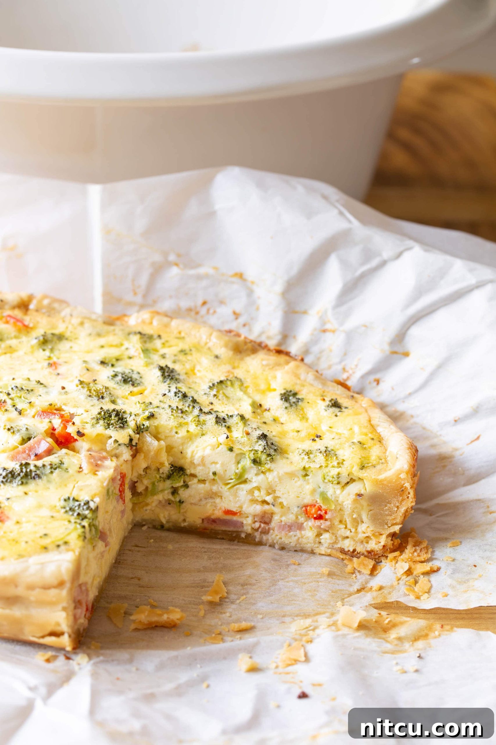 Quiche with slice removed. 