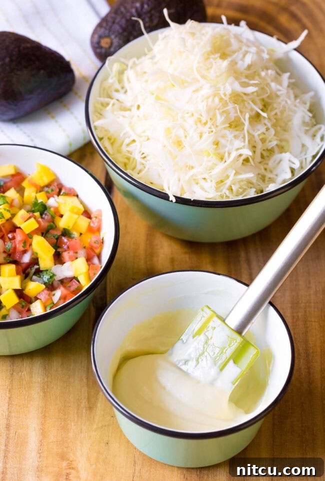 Aloha Ahi Poke Nachos 6 Stirring wasabi mayo in a small bowl with a rubber spatula.
