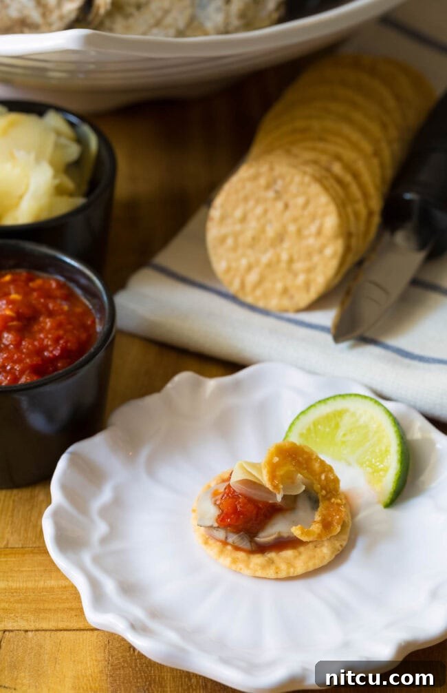 Mastering the Oyster Shuck 16 Oyster on rice cracker