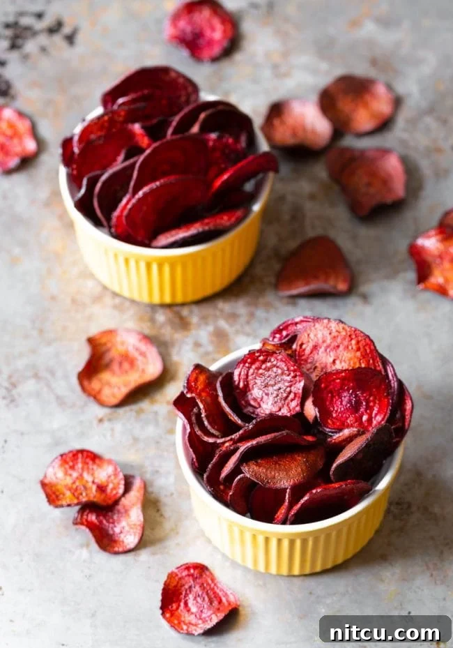 Wholesome Beet Crisps 7 Finished baked chips served in small yellow bowls. Ready to eat!