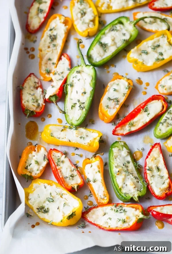 Mini Pepper Poppers 2 Love these 3-Ingredient Mini Stuffed Peppers Recipe on baking sheet
