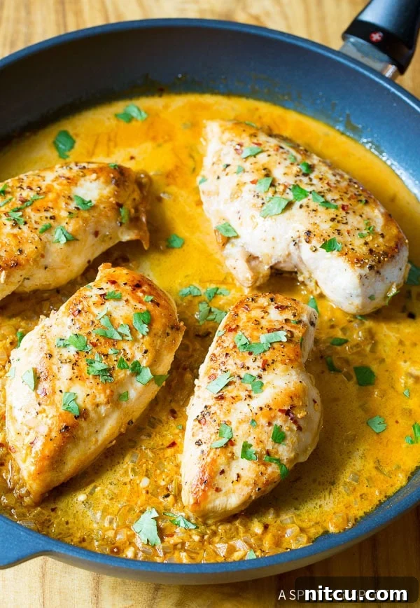 Zesty Garlic Lime Chicken 2 Top down view of garlic lime chicken in a skillet, garnished with fresh cilantro.