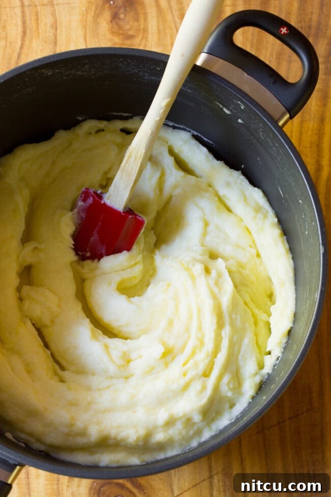 mashed potatoes recipe Top view of freshly mashed potatoes in large pot