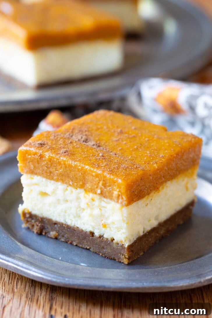 Spiced Pumpkin Cheesecake Squares 2 Delightful Layered Pumpkin Cheesecake Bars, a perfect fall dessert.