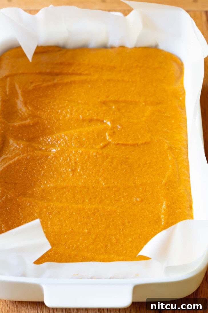 Spiced Pumpkin Cheesecake Squares 8 The smooth, evenly spread pumpkin layer, ready for chilling.