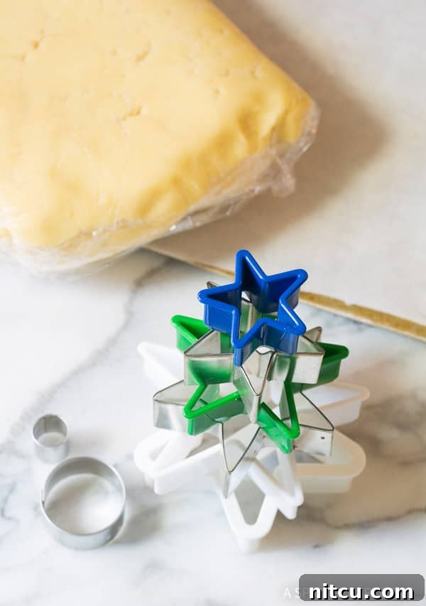 Making Christmas Tree Cookies with star cookie cutters
