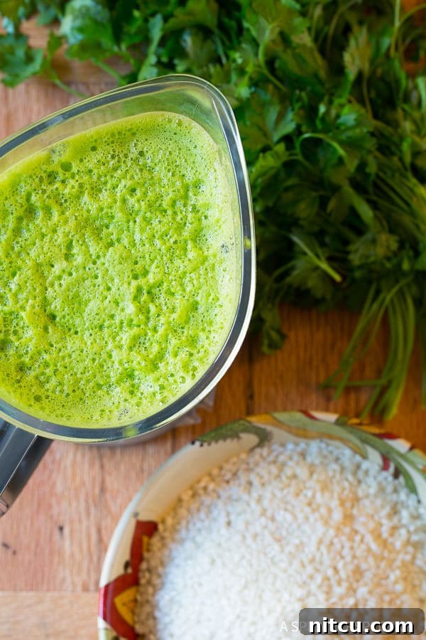 Creamy Spinach Risotto 5 Risotto and Spinach - spinach and herb purée in blender to be poured over risotto.