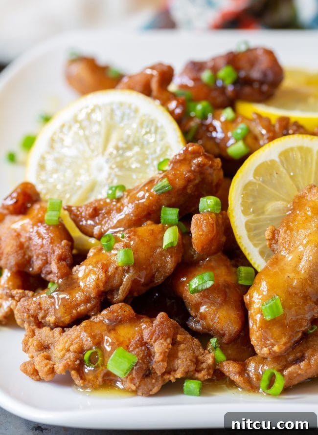Zesty Lemon Paleo Chicken 2 Crispy Paleo Lemon Chicken glazed with tangy sauce