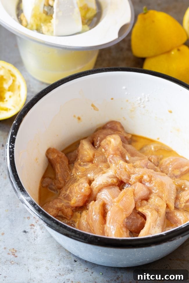 lemon-chicken-breast-recipe Crispy paleo lemon chicken breast pieces coated in a flavorful sauce.