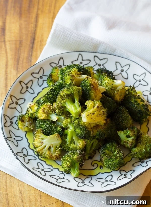 Crispy Roasted Broccoli 7 Delicious and healthy oven roasted broccoli side dish on a plate