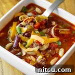 A close-up of the Slow Cooker Chili Mac and Cheese recipe, showcasing its rich texture and appetizing appearance, ready for serving.