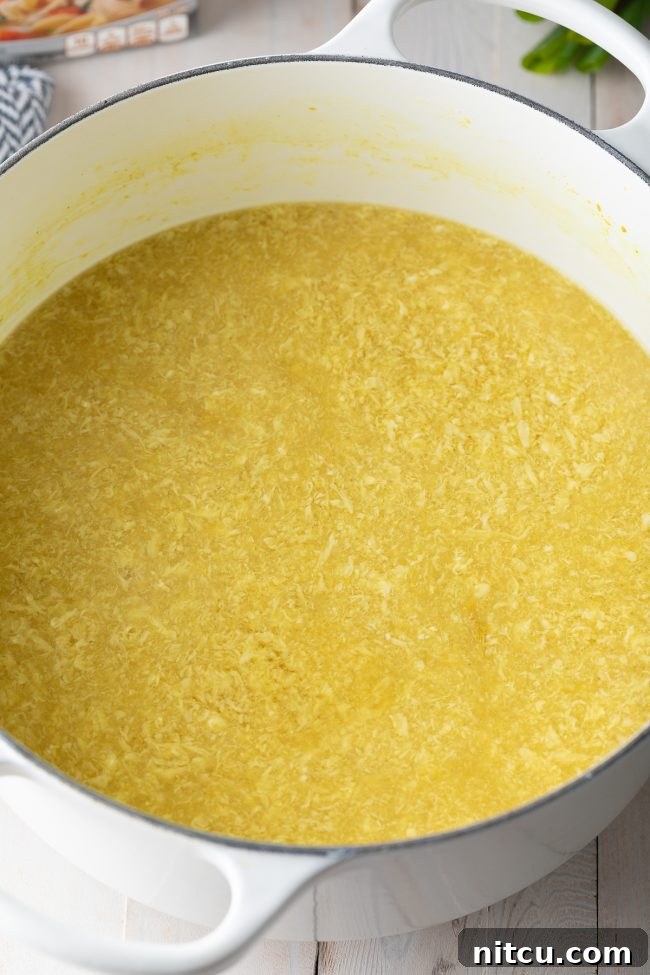 Cozy Kitchen Egg Drop Soup 6 Large pot of soup with ribbons of eggs.