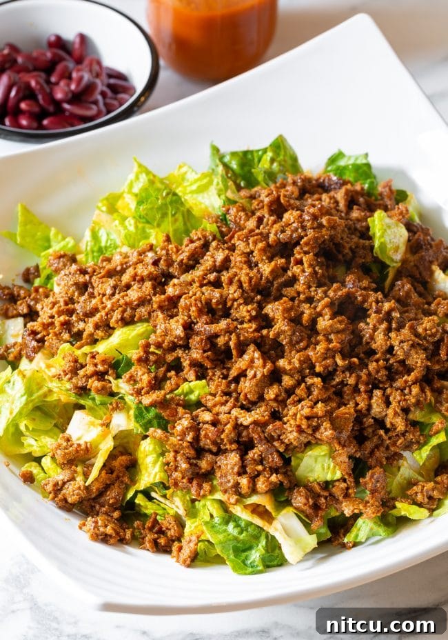 Legendary Dorito Taco Salad 8 A mix of halved grape tomatoes and sliced green onions.