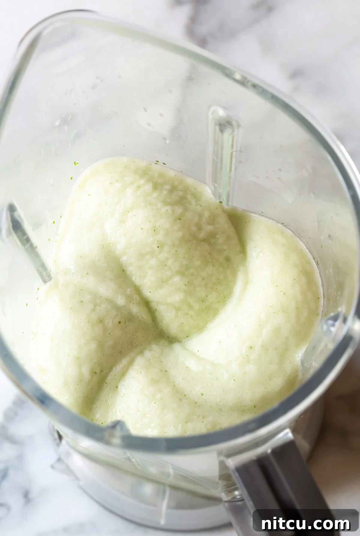 Coconut-Mojito Refreshing Coconut Mojito garnished with mint and lime