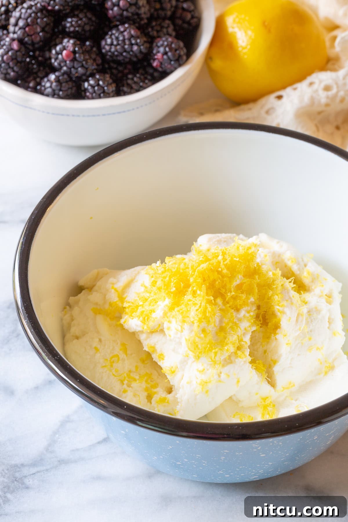 Golden Cheese Blintzes 3 Ingredients for sweet ricotta cream in a mixing bowl, ready for blending