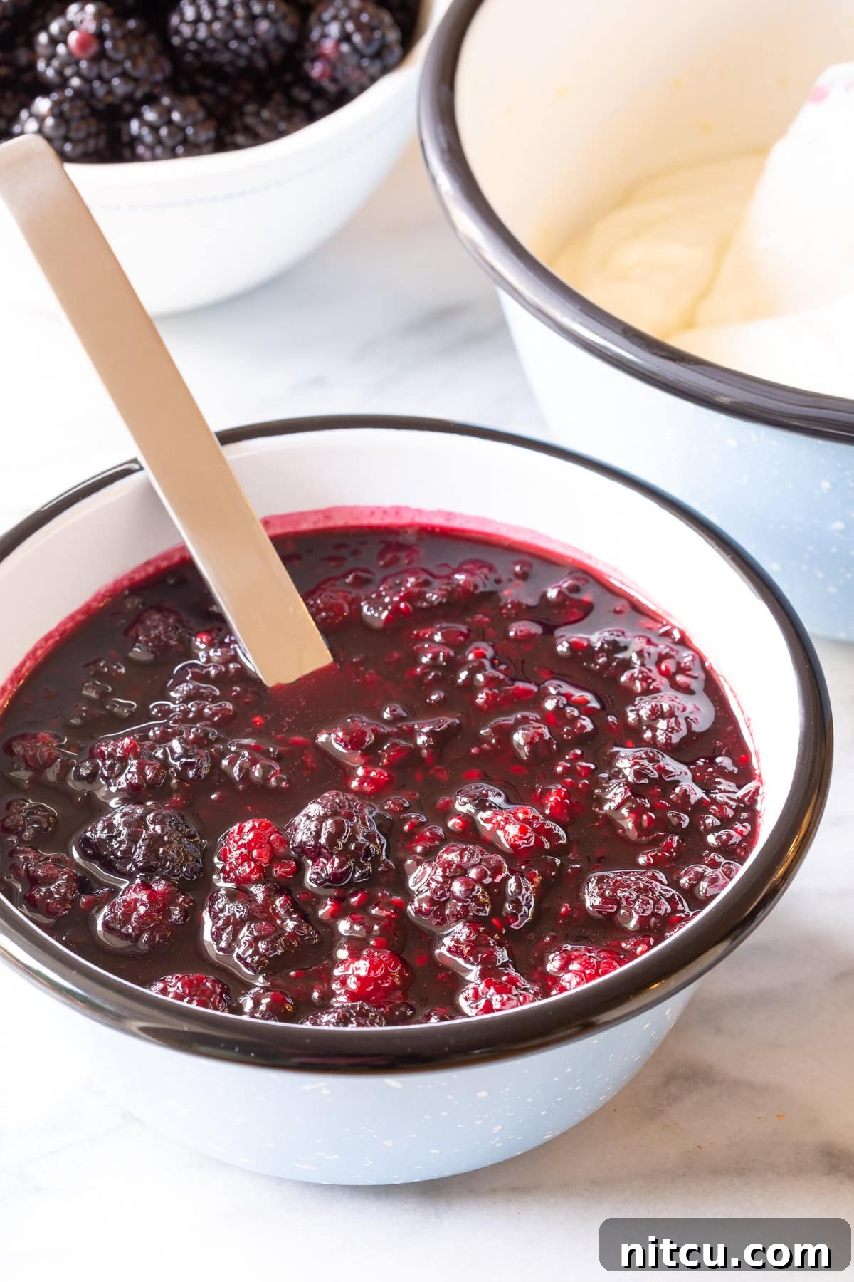 Golden Cheese Blintzes 4 Fresh blackberry sauce ingredients mixed in a bowl, ready for simmering